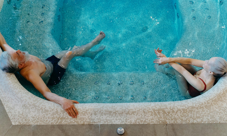 older couple relaxing in a pool