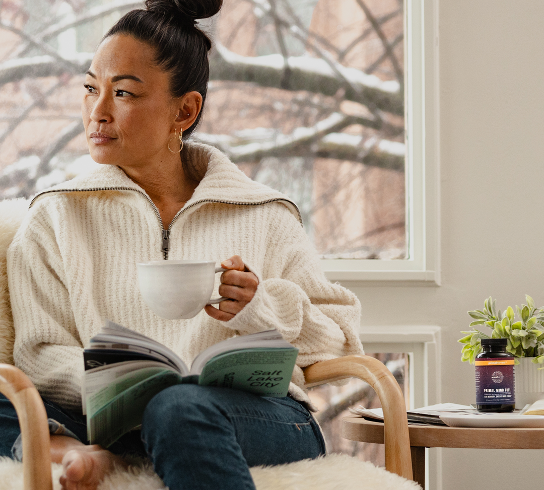 Woman drinking tea with primal mind fuel